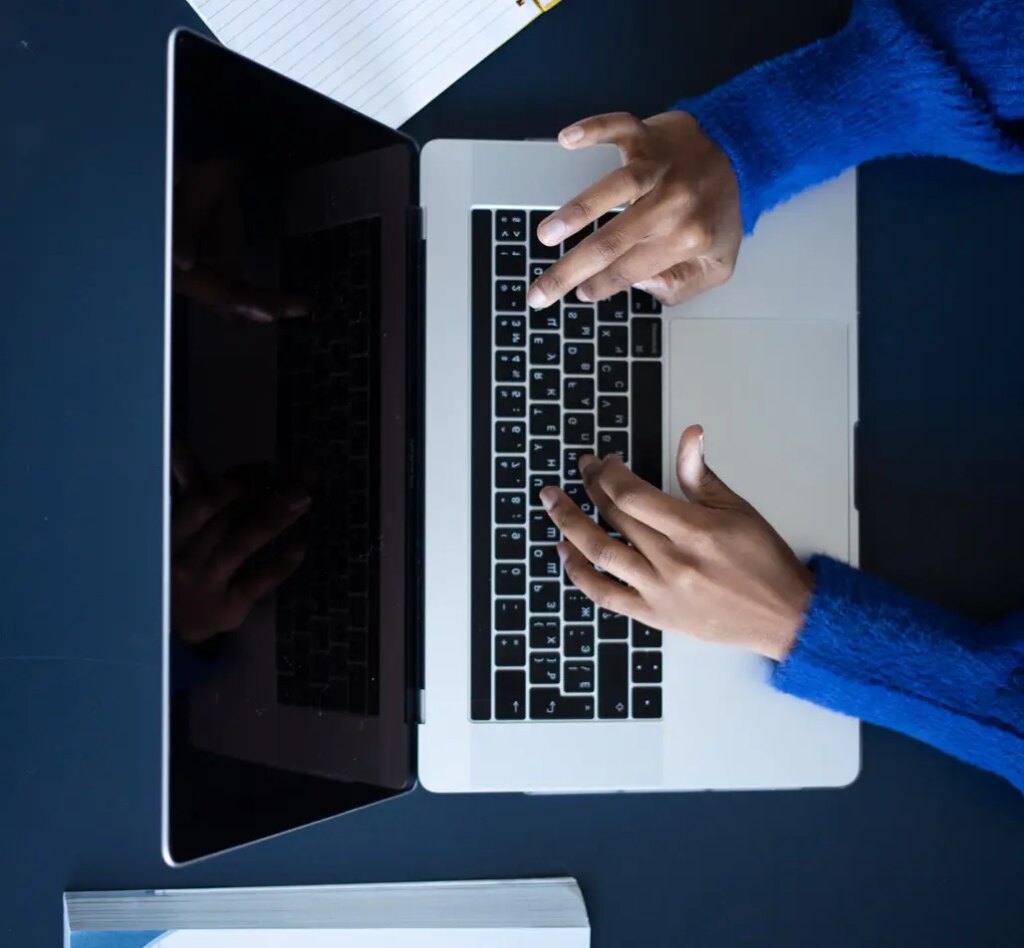 A man is using google search on his laptop.